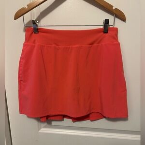 Nike athletic skort with back pleats. Tennis, golf, pickleball. Coral. NWOT